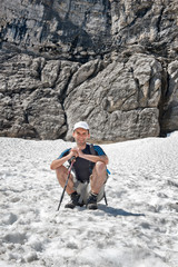 Sticker - Male Hiker sitting on a snow field