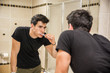 © theartofphoto - Headshot of attractive young man brushing teeth