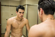 © theartofphoto - Shirtless muscular handsome young man in bathroom
