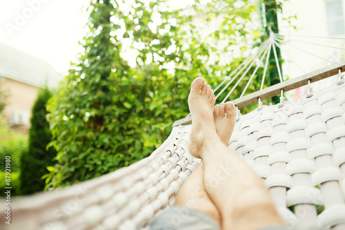 Valokuva Man in a hammock on a summer day, close up photo