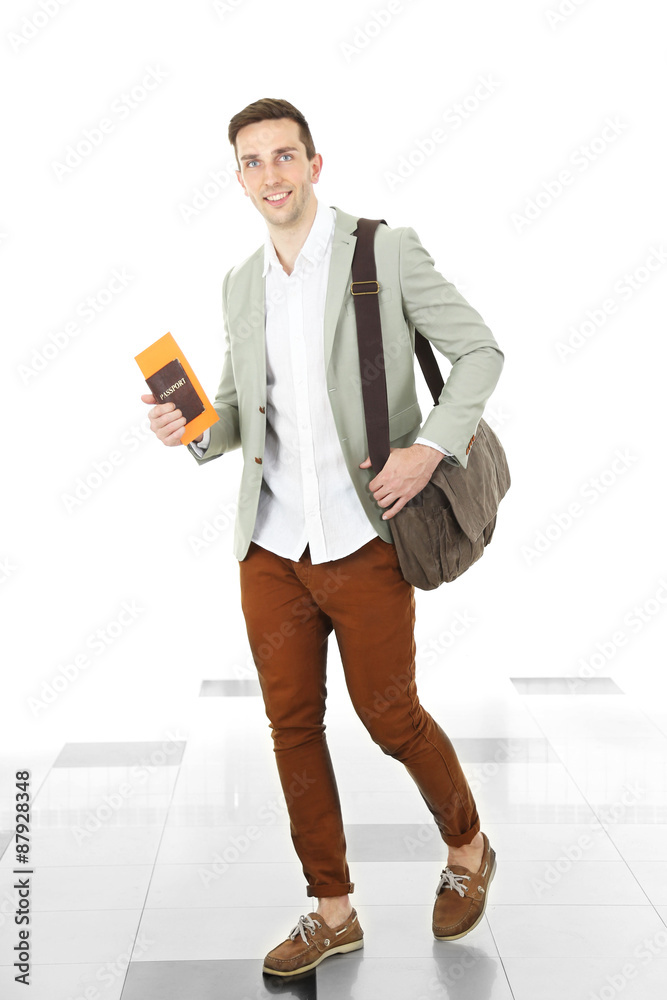 Man holding handbag on light background