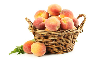 Canvas Print - Fresh peach fruit in basket isolated on a white