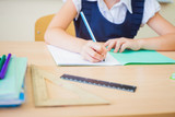 Fototapeta  - Desktop background of student sitting at desk for classwork