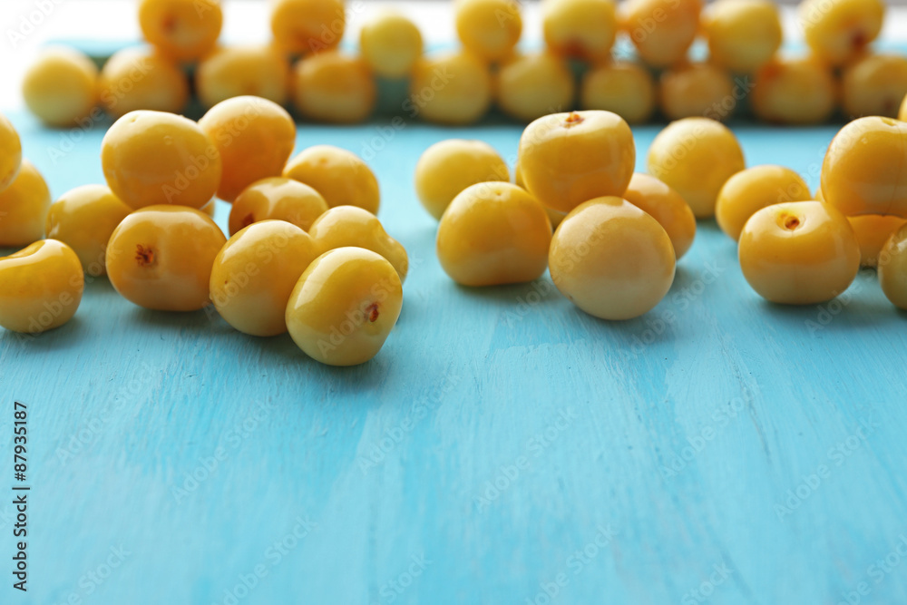 Ripe cherry-plums on wooden table close up