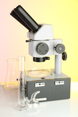 Wall Mural - test tubes and microscope on bright background