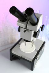 Wall Mural - test tubes and microscope on bright background