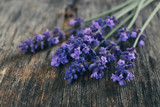 Fototapeta Lawenda - Lavender flowers on table close up