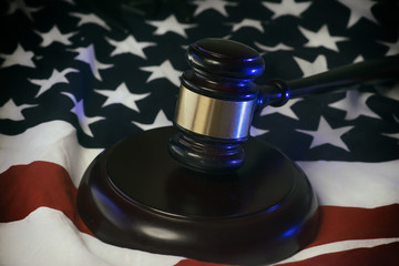 Wall Mural - American legal law system concept image - gavel on flag