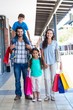 © WavebreakmediaMicro - Happy family having fun in the mall