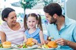 © WavebreakmediaMicro - A family eating at the restaurant