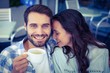 © WavebreakmediaMicro - Cute couple having coffee together