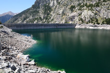 Artificial Lake With A Dam In The Mountains