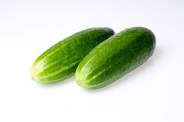 Two cucumbers isolated on white background