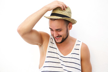 Wall Mural - Young man with beard and hat laughing