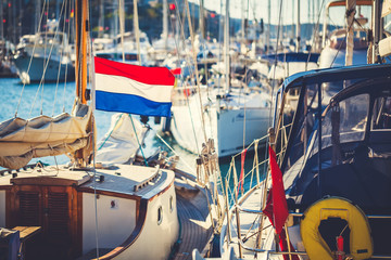 Flag of Netherlands against the background ship.