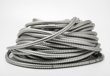 Flexible metal pipe on a white background.