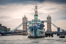 HMS Belfast In Front Of Tower Bridge On River Thames