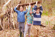 © micromonkey - Children Building Camp In Forest Together