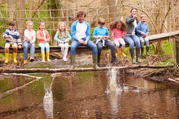 Wall Mural - Adults With Children On Bridge At Outdoor Activity Centre