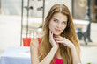 © Andrey_Arkusha - Young beautiful blonde woman sitting in a summer restaurant