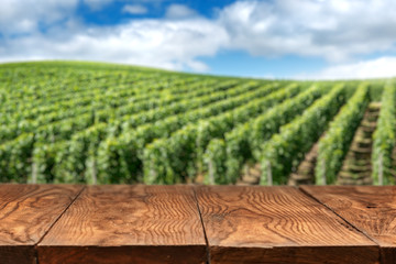 wooden table with vineyard landscape