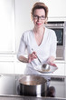 © Jürgen Hüls - attractive woman in modern ktchen cooking