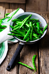 fresh, organic green beans in a vintage colander