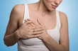© pathdoc - cropped portrait young woman with breast pain touching chest