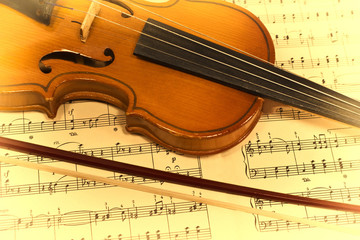 Old violin and musical notes