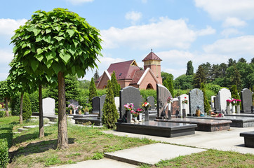 Wall Mural - Tombstones and a chapel in the public cemetery