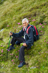 Senior man hiker resting