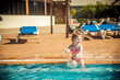 © Ievgen Skrypko - girl playing in the pool