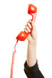 © Robert Kneschke - Hand hält roten Telefonhörer
