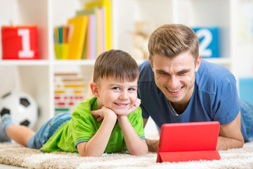 Poster - Father and son playing with digital tablet