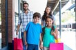 © WavebreakmediaMicro - Happy family having fun in the mall