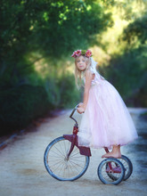 Girl Standing On A Vintage Bike