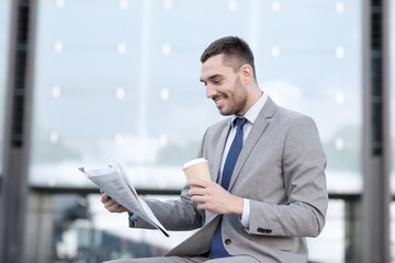 Sticker - young businessman with coffee and newspaper