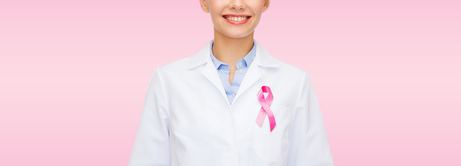 Poster - smiling female doctor with cancer awareness ribbon