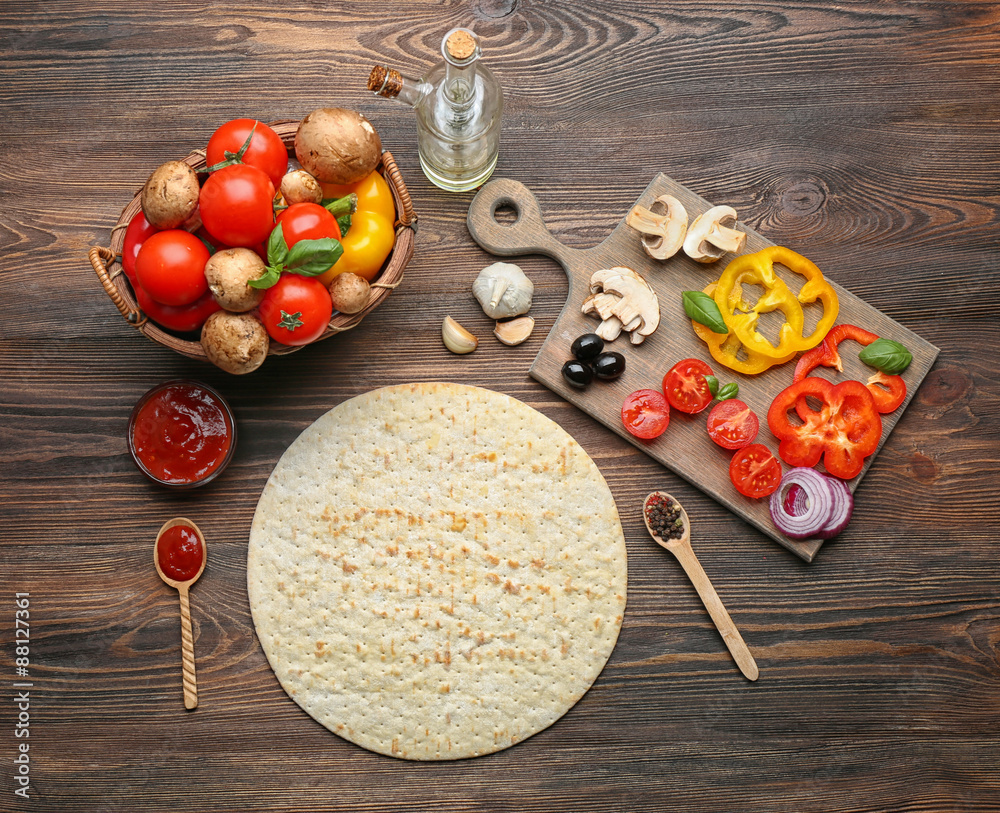 Ingredients for cooking pizza on wooden table, top view