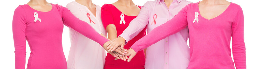 Wall Mural - close up of women with cancer awareness ribbons