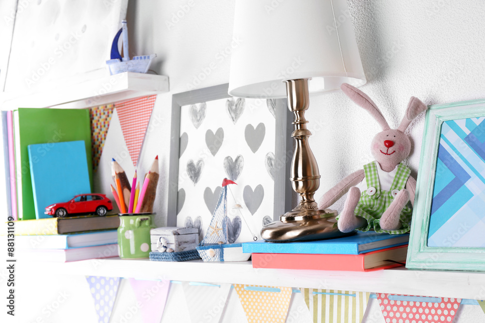 Shelves with toys in child room close-up