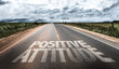 © gustavofrazao - Positive Attitude written on rural road