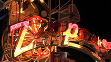 Midway Carnival Lights 13. The Zipper Carnival Ride At The CNE Midway In Toronto, Canada.