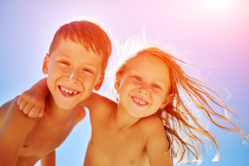 boy and girl looks into the camera
