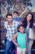 © WavebreakmediaMicro - Portrait of a happy family having fun in the mall