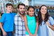 © WavebreakmediaMicro - Happy family having fun in the mall