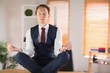 © WavebreakMediaMicro - Calm businessman meditating in lotus pose