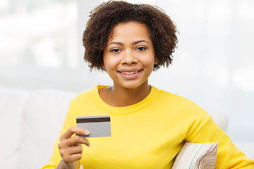 Poster - happy african woman with credit or debit card