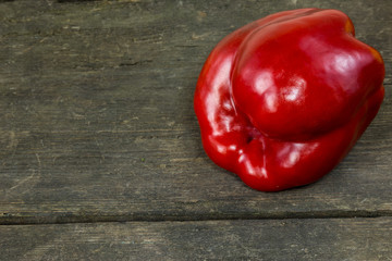 Sweet pepper on a rustic wooden background