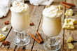 hot white chocolate decorated with whipped cream with cinnamon